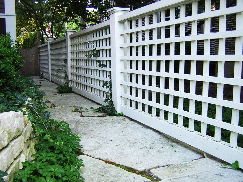 long-and-firm-white-lattice-fence-design-with-concrete-patio-design-with-greenery-beneath-shady-tree
